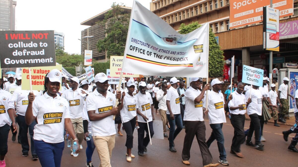 Demonstrators on an anti-corruption march carrying banners addressed to government.