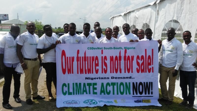 Campaigners with a climate action banner at a march in Port Harcourt, Nigeria.