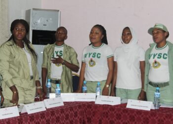 Members of the National Youth Service Corps in uniform at an official event in Nigeria.