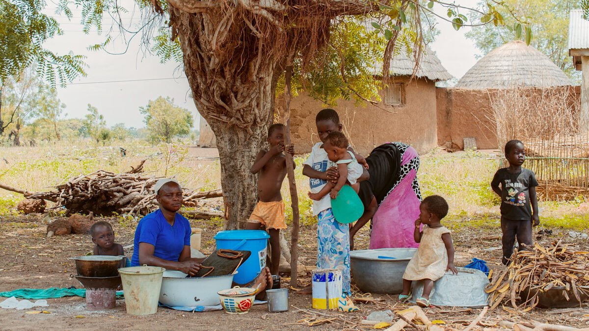 A family at work in a village compound in West Africa.