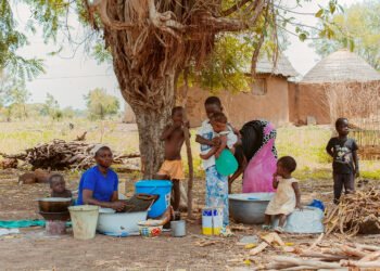 A family at work in a village compound in West Africa.