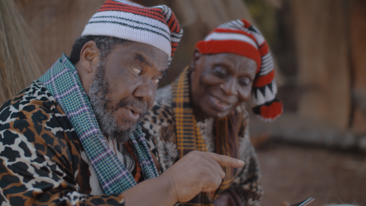 Two Igbo elders in a dramatised scene illustrating Achebe's Things Fall Apart.