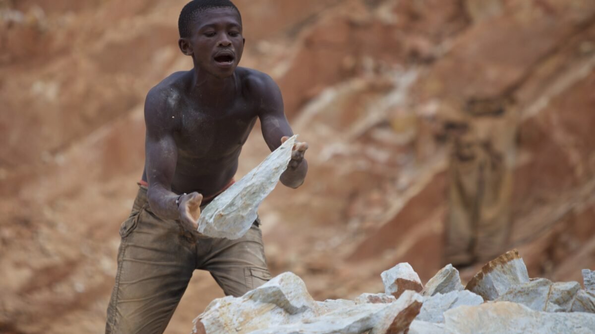 Stoneworkers breaking rock by hand in the Central African Republic.
