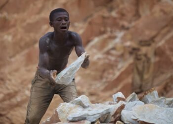Stoneworkers breaking rock by hand in the Central African Republic.