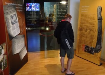 A visitor viewing exhibits at the Kigali Genocide Memorial Centre.