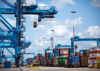 Gantry cranes and stacked containers at the port of Mombasa, Kenya.