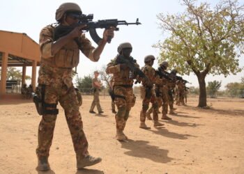 Burkinabe soldiers responding to a simulated ambush during a multinational training exercise.