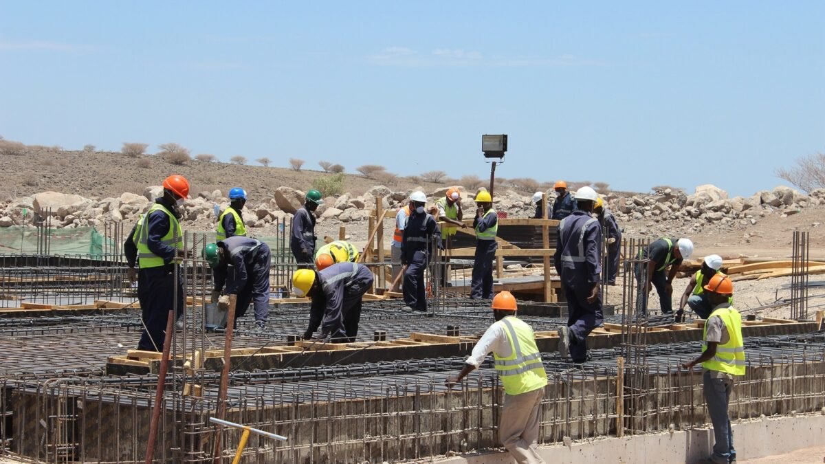 Workers pouring foundations at the Lake Turkana wind power project, Kenya.