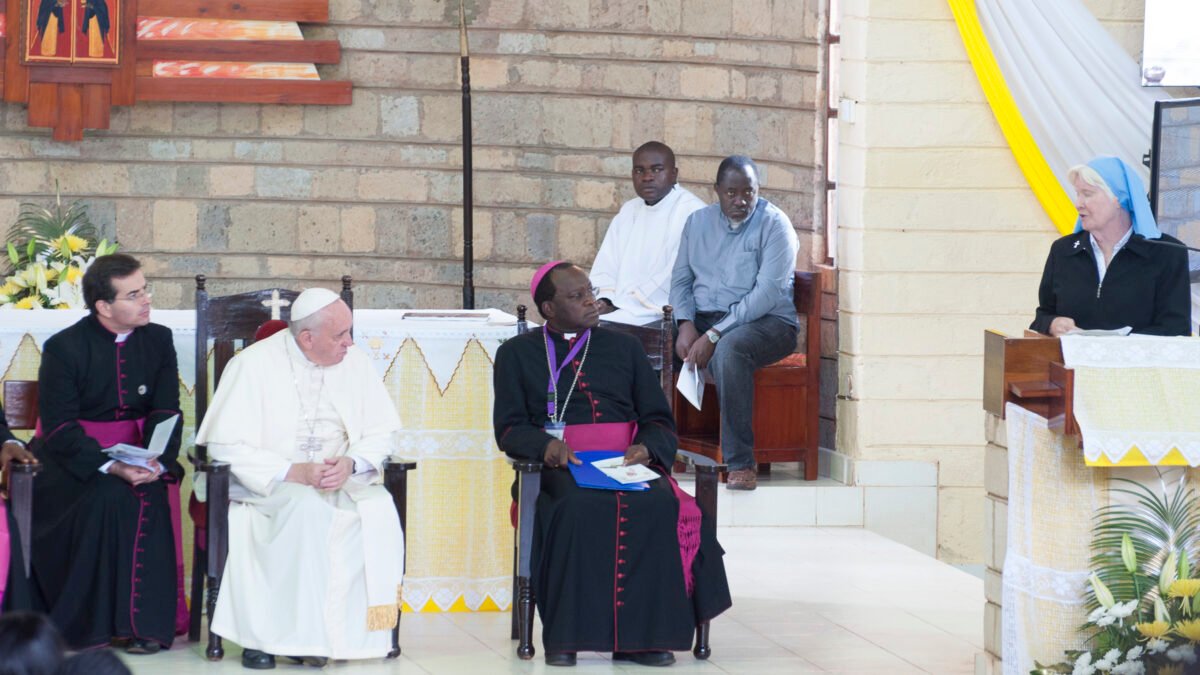 Pope Francis seated with African clergy during a visit to St Joseph the Worker parish, Kangemi, Nairobi.