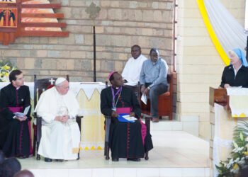 Pope Francis seated with African clergy during a visit to St Joseph the Worker parish, Kangemi, Nairobi.