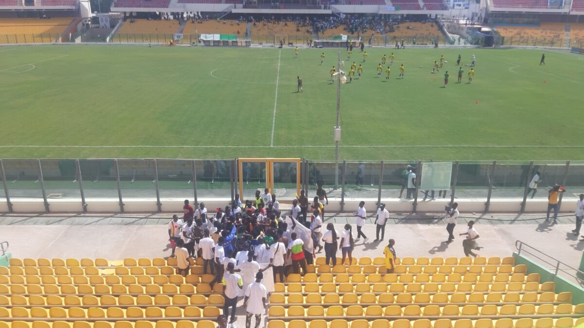 The pitch and empty stands at Accra Sports Stadium, Ghana.