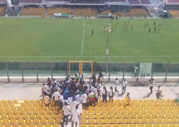 The pitch and empty stands at Accra Sports Stadium, Ghana.