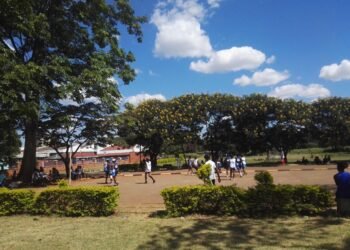 Girls playing competitive netball at a school ground in Africa.